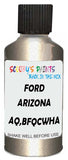 Detail brush applying Beige Metallic to a small door scratch on an Ford Focus, clean OEM finish