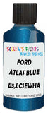 Detail brush applying Blue Metallic to a small door scratch on an Ford Explorer, clean OEM finish