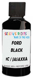 Detail brush applying Black Solid to a small door scratch on an Ford Elite, clean OEM finish