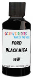 Detail brush applying Black Solid to a small door scratch on an Ford Ranger, clean OEM finish