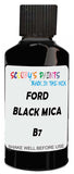 Detail brush applying Black Solid to a small door scratch on an Ford Australia Ranger, clean OEM finish