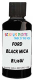 Detail brush applying Black Solid to a small door scratch on an Ford Australia Ranger, clean OEM finish