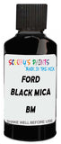 Detail brush applying Black Solid to a small door scratch on an Ford Australia Fiesta, clean OEM finish
