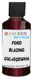 Detail brush applying Red Metallic to a small door scratch on an Ford Edge, clean OEM finish