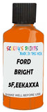 Detail brush applying Orange Solid to a small door scratch on an Ford Heavy Truck, clean OEM finish
