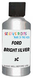 Detail brush applying Silver Metallic to a small door scratch on an Ford Festiva, clean OEM finish
