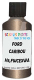 Detail brush applying Beige Metallic to a small door scratch on an Ford Taurus, clean OEM finish