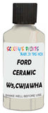 Detail brush applying White Solid to a small door scratch on an Ford Thunderbird, clean OEM finish