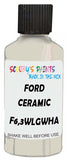 Detail brush applying White Solid to a small door scratch on an Ford Explorer, clean OEM finish