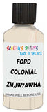 Detail brush applying White Solid to a small door scratch on an Ford F-Series, clean OEM finish