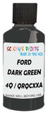 Detail brush applying Green Solid to a small door scratch on an Ford Custom, clean OEM finish