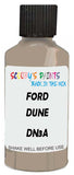 Detail brush applying Beige Solid to a small door scratch on an Ford Flex, clean OEM finish