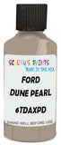 Detail brush applying Beige Solid to a small door scratch on an Ford Taurus-X, clean OEM finish