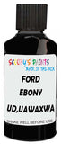 Detail brush applying Black Solid to a small door scratch on an Ford Mustang, clean OEM finish