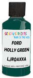 Detail brush applying Green Solid to a small door scratch on an Ford Heavy Truck, clean OEM finish