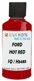Detail brush applying Red Solid to a small door scratch on an Ford Festiva, clean OEM finish
