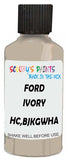 Detail brush applying White Solid to a small door scratch on an Ford Explorer, clean OEM finish
