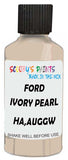 Detail brush applying White Solid to a small door scratch on an Ford Explorer, clean OEM finish