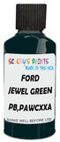 Detail brush applying Green Solid to a small door scratch on an Ford F-Series, clean OEM finish