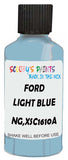 Detail brush applying Blue Solid to a small door scratch on an Ford Transit, clean OEM finish