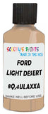 Detail brush applying Beige Solid to a small door scratch on an Ford Bronco, clean OEM finish
