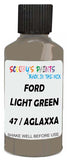 Detail brush applying Green Solid to a small door scratch on an Ford Elite, clean OEM finish