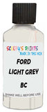 Detail brush applying White Solid to a small door scratch on an Ford Transit, clean OEM finish