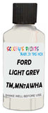 Detail brush applying White Solid to a small door scratch on an Ford Explorer, clean OEM finish