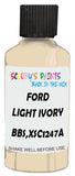 Detail brush applying White Solid to a small door scratch on an Ford Focus, clean OEM finish