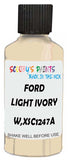 Detail brush applying White Solid to a small door scratch on an Ford Fiesta, clean OEM finish