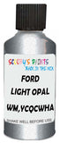 Detail brush applying White Metallic to a small door scratch on an Ford Windstar, clean OEM finish