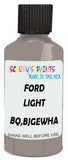 Detail brush applying Gold Solid to a small door scratch on an Ford Escape, clean OEM finish