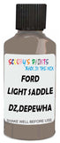 Detail brush applying Brown Solid to a small door scratch on an Ford Explorer, clean OEM finish