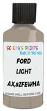 Detail brush applying Beige Solid to a small door scratch on an Ford Escort, clean OEM finish