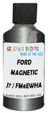 Detail brush applying Grey Metallic to a small door scratch on an Ford F-Series F-250/550 Platinum, clean OEM finish