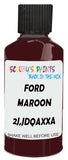 Detail brush applying Brown Solid to a small door scratch on an Ford Mustang, clean OEM finish