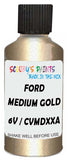 Detail brush applying Gold Metallic to a small door scratch on an Ford Elite, clean OEM finish