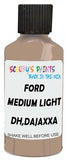Detail brush applying Brown Solid to a small door scratch on an Ford F-Series, clean OEM finish