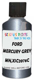 Detail brush applying Grey Metallic to a small door scratch on an Ford Transit, clean OEM finish