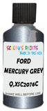 Detail brush applying Grey Metallic to a small door scratch on an Ford Fiesta, clean OEM finish