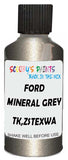 Detail brush applying Grey Metallic to a small door scratch on an Ford Escape, clean OEM finish