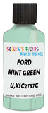 Detail brush applying Green Metallic to a small door scratch on an Ford Fiesta, clean OEM finish