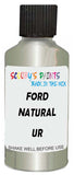 Detail brush applying White Metallic to a small door scratch on an Ford Focus, clean OEM finish