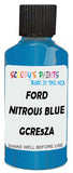 Detail brush applying Blue Metallic to a small door scratch on an Ford Mondeo, clean OEM finish