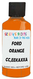 Detail brush applying Orange Solid to a small door scratch on an Ford Medium Truck, clean OEM finish
