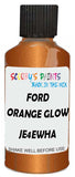 Detail brush applying Orange Metallic to a small door scratch on an Ford Transit Custom, clean OEM finish