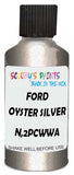 Detail brush applying Silver Metallic to a small door scratch on an Ford Ranger, clean OEM finish