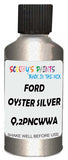 Detail brush applying Silver Metallic to a small door scratch on an Ford Fiesta, clean OEM finish