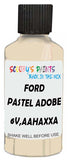 Detail brush applying Beige Solid to a small door scratch on an Ford Mustang, clean OEM finish