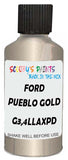 Detail brush applying Gold Metallic to a small door scratch on an Ford Focus, clean OEM finish